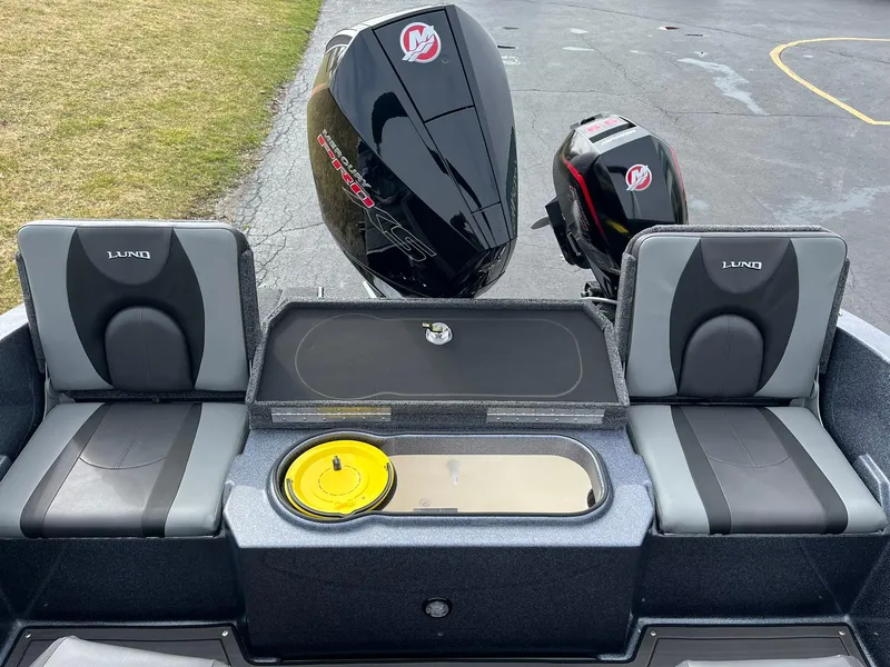 Slide: The Image of 2024 Lund 189 Tyee GL boat interior with dual Mercury engines. - 15