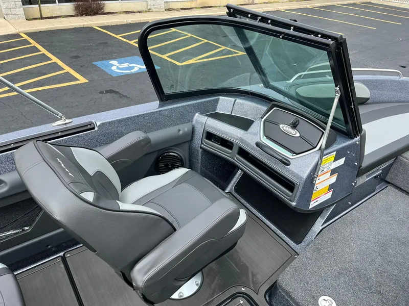 Slide: The Image of 2024 Lund 189 Tyee GL boat interior with seating and dashboard. - 18