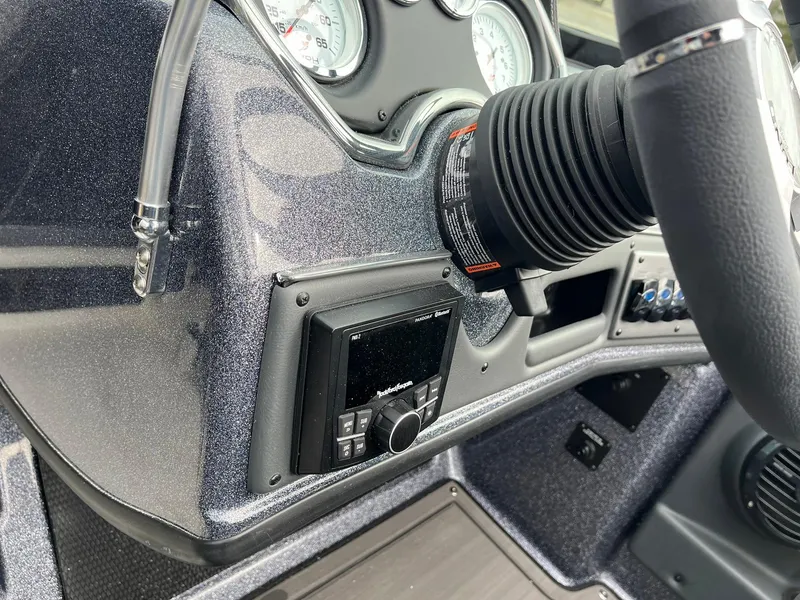 Slide: The Image of 2024 Lund 189 Tyee GL dashboard with steering wheel and control panel. - 26