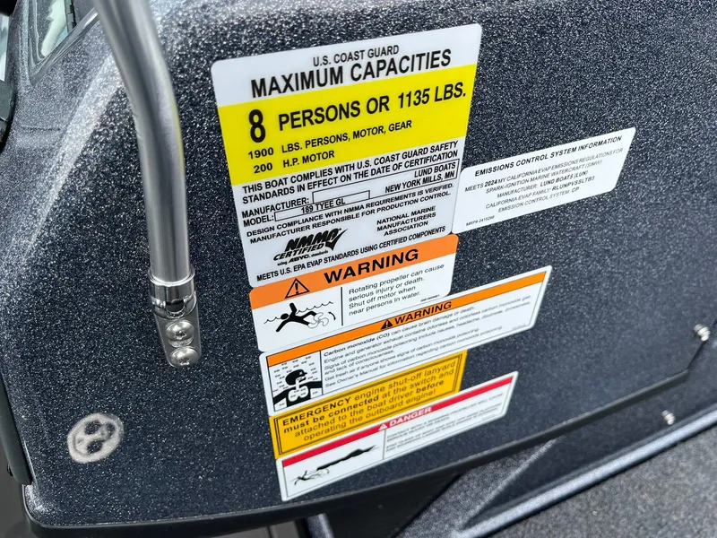 Slide: The Image of Capacity warning label on 2024 Lund 189 Tyee GL boat, indicating 8-person limit. - 28