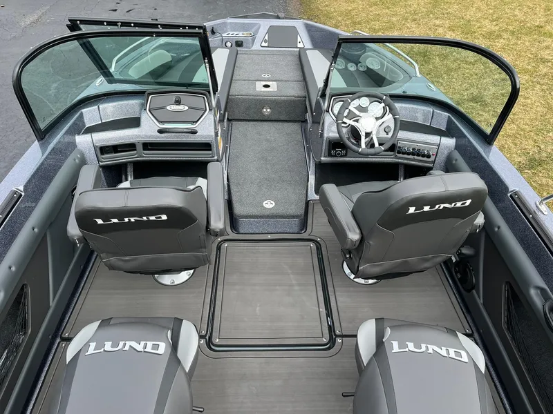 Slide: The Image of 2024 Lund 189 Tyee GL boat interior with seating and steering console. - 8