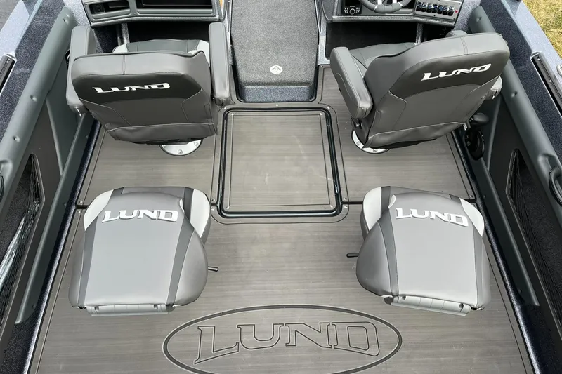 Slide: The Image of 2024 Lund 189 Tyee GL boat interior with four branded seats and sleek flooring. - 9