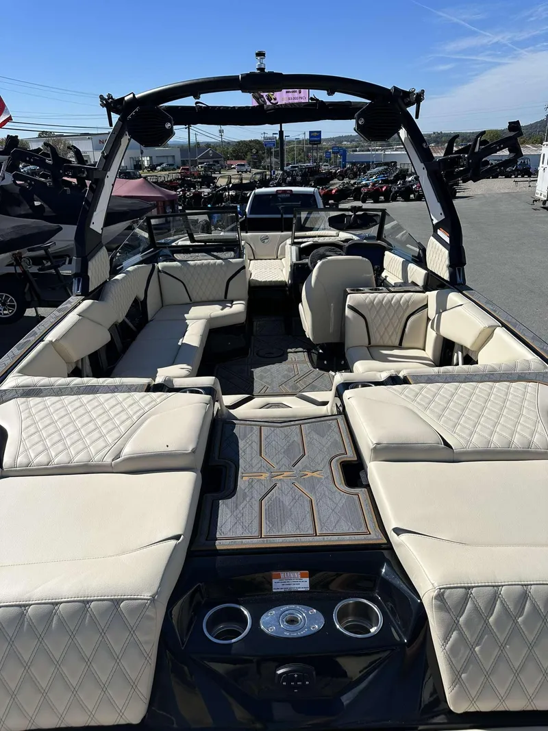 Slide: The Image of 2024 Tigé 24RZX boat with luxurious seating and modern design. - 12