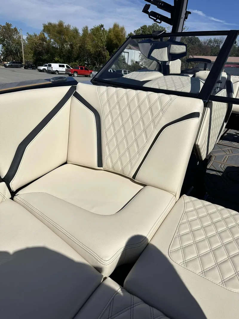 Slide: The Image of 2024 Tigé 24RZX boat with luxurious white leather seating and diamond stitching. - 13