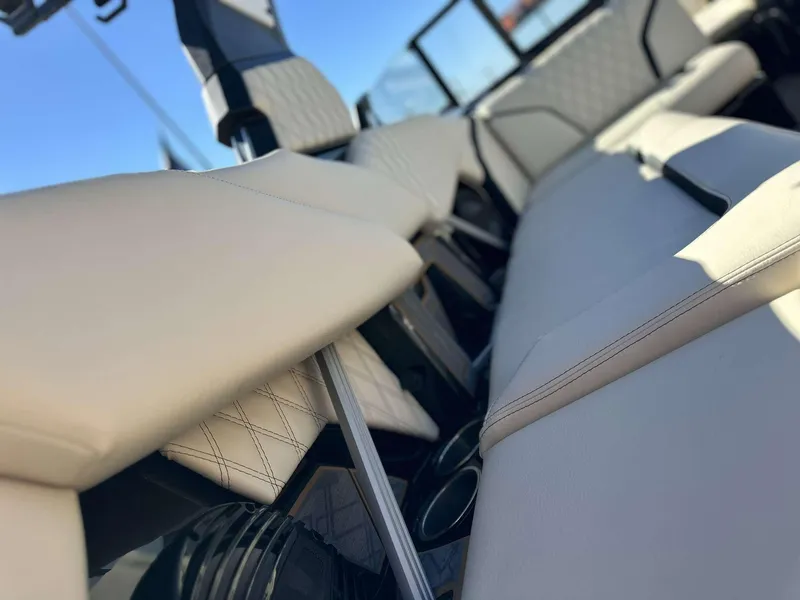 Slide: The Image of 2024 Tigé 24RZX boat interior with luxurious white seating and modern design. - 15
