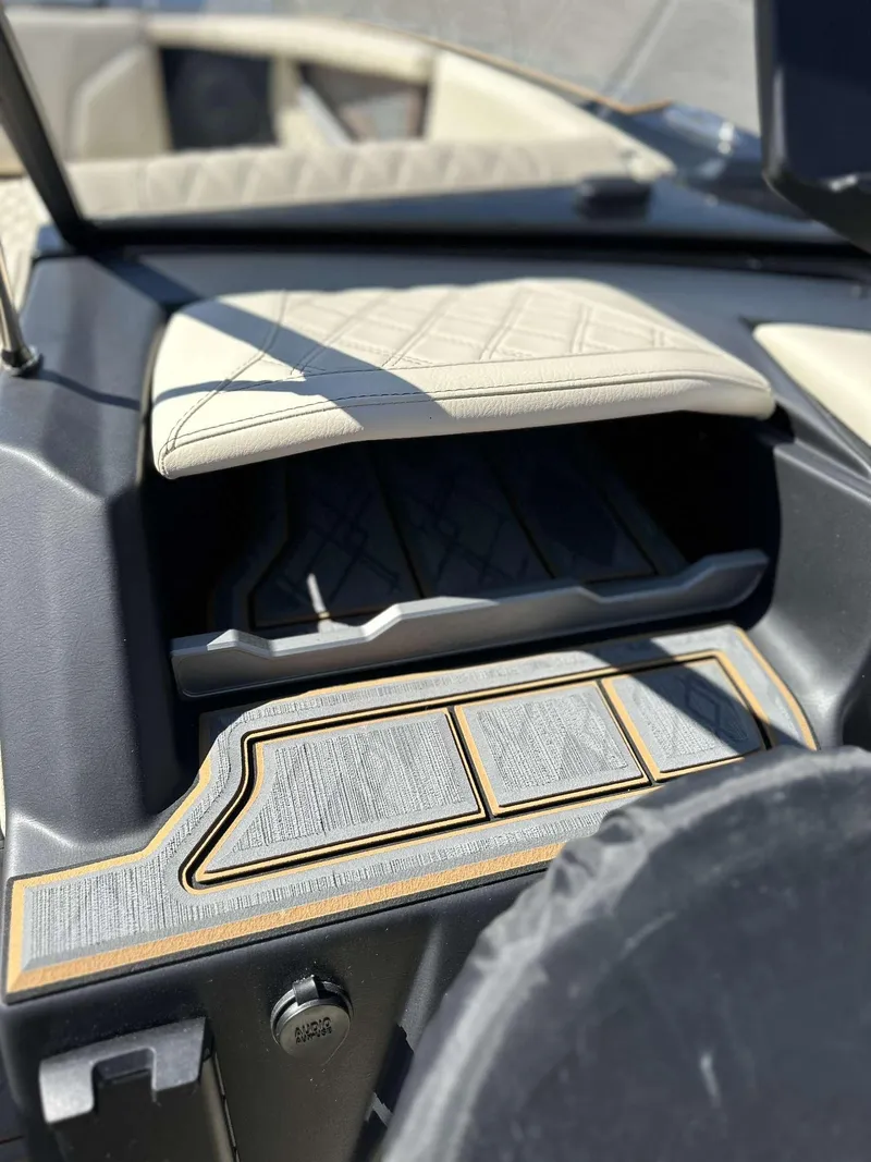 Slide: The Image of 2024 Tigé 24RZX boat interior with luxurious seating and modern dashboard design. - 18