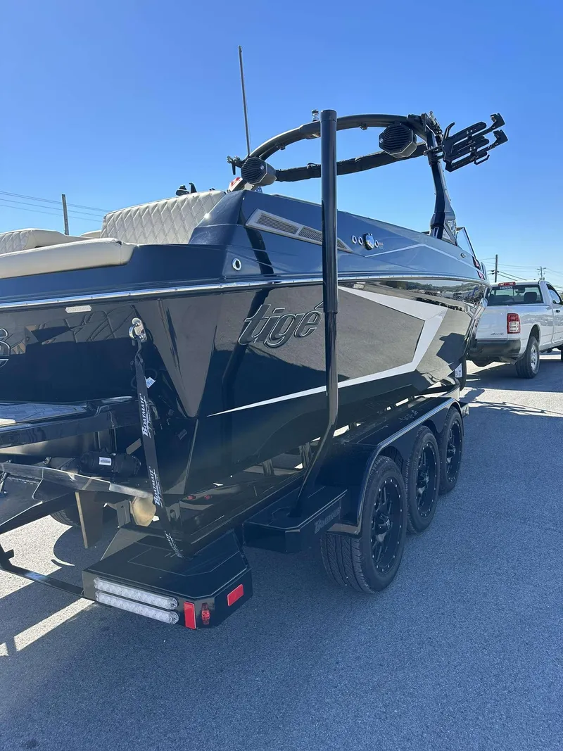 Slide: The Image of 2024 Tigé 24RZX boat on a trailer, rear view. - 2