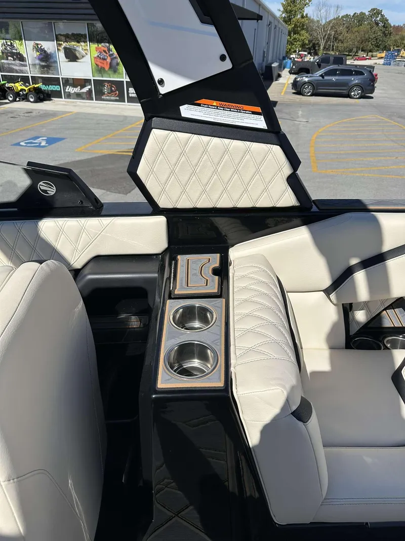 Slide: The Image of 2024 Tigé 24RZX boat interior with cup holders and quilted upholstery. - 23