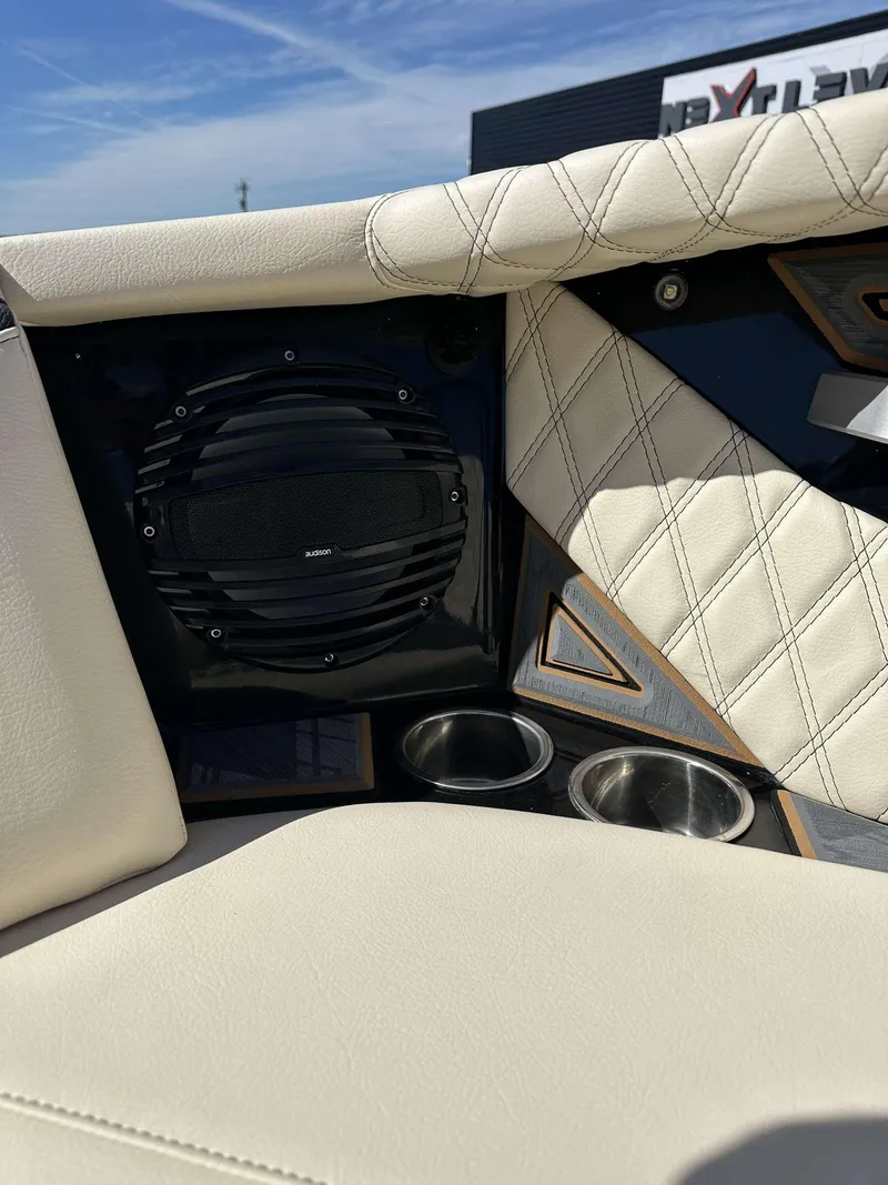 Slide: The Image of 2024 Tigé 24RZX boat interior with speaker and cup holders. - 25