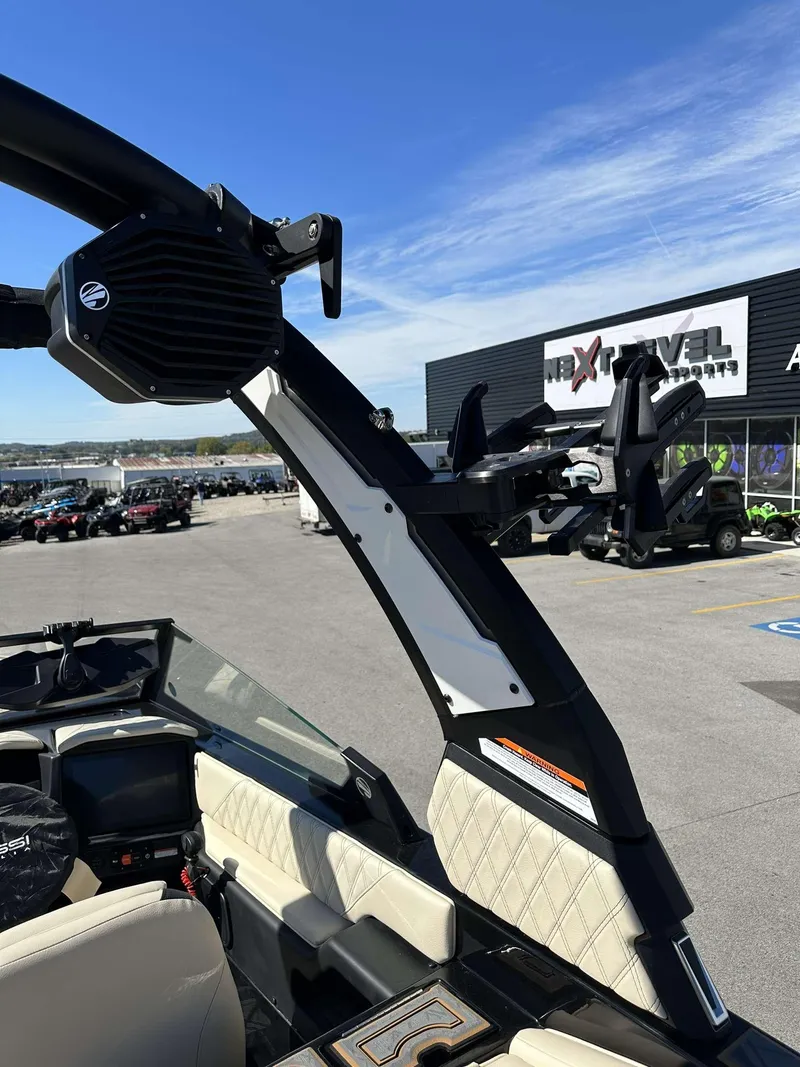 Slide: The Image of 2024 Tigé 24RZX boat with tower speakers and wakeboard racks. - 33