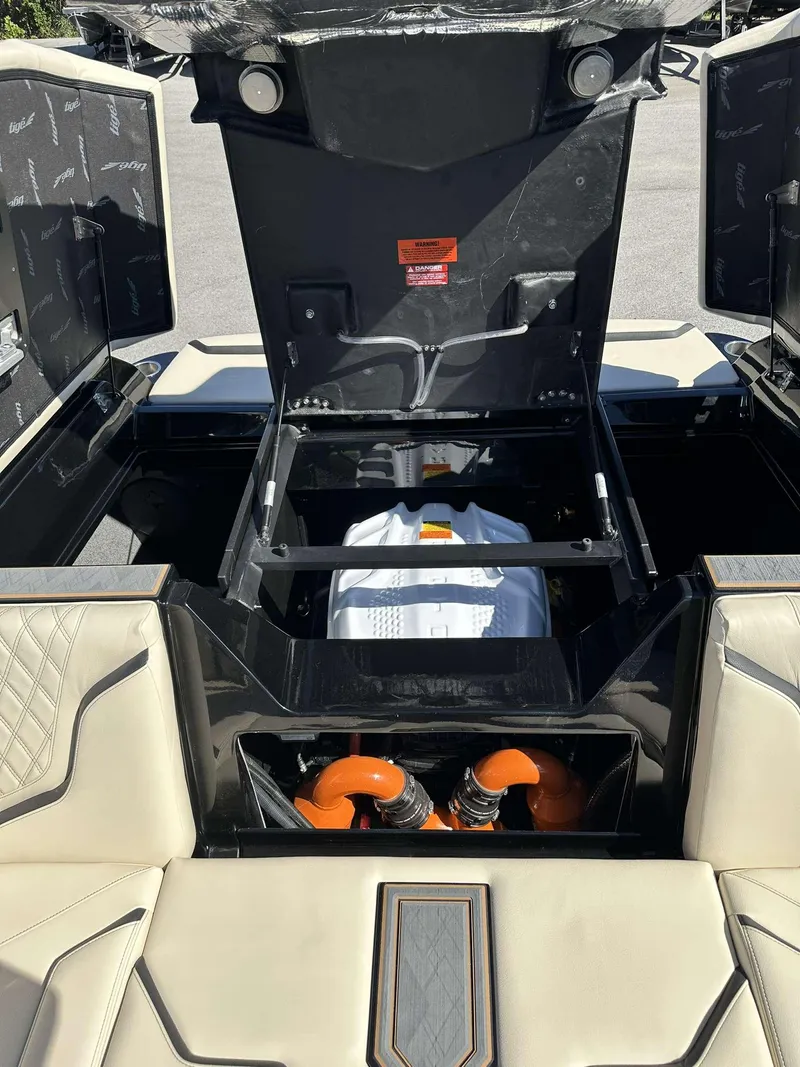 Slide: The Image of 2024 Tigé 24RZX boat engine compartment with open hatches. - 34