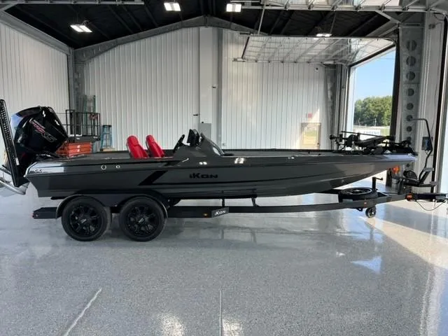 Slide: The Image of 2024 iKon LX21 boat in a showroom, side view. - 1