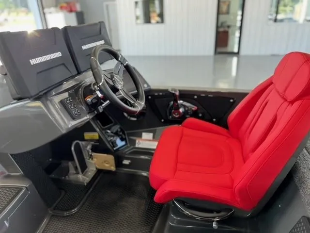 Slide: The Image of 2024 iKon LX21 boat cockpit with red captain's chair and dual Humminbird displays. - 10