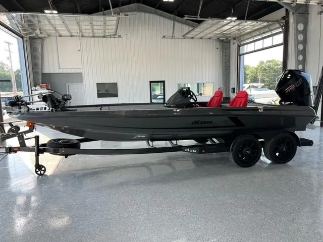 Slide: The Image of 2024 iKon LX21 fishing boat with red seats in a showroom. - 4