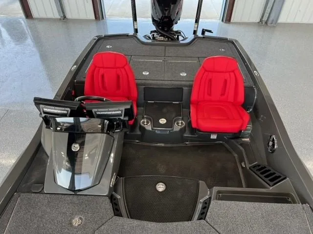 Slide: The Image of 2024 iKon LX21 boat interior with red seats and dual consoles. - 8
