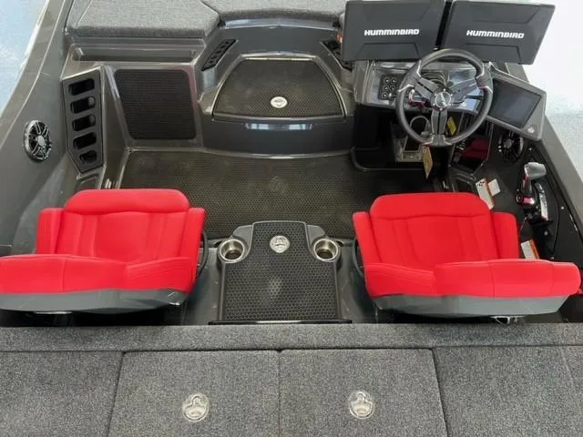 Slide: The Image of 2024 iKon LX21 boat interior with red seats and dual Humminbird displays. - 9