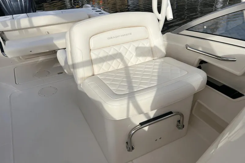 Slide: The Image of 2024 Grady-White Freedom 235 boat with luxurious white seating. - 12