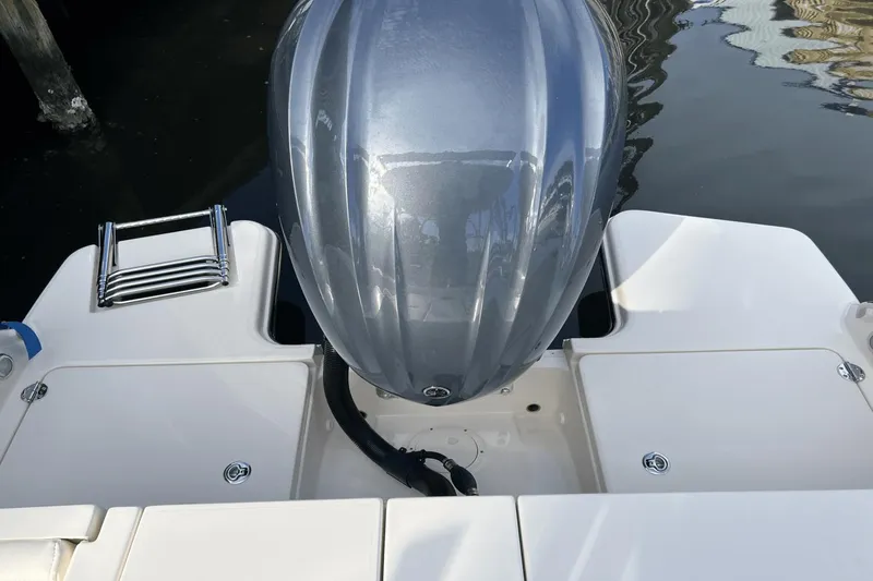 Slide: The Image of 2024 Grady-White Freedom 235 boat engine and swim platform. - 2
