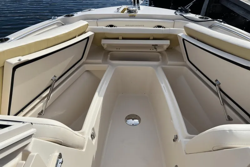 Slide: The Image of 2024 Grady-White Freedom 235 boat interior with open storage compartments. - 20