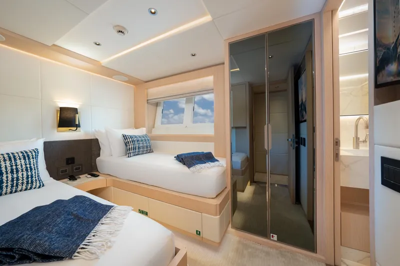 Slide: The Image of Luxurious cabin interior of 2020 Majesty 100 yacht with twin beds and modern decor. - 12