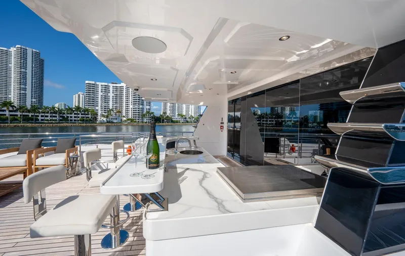 Slide: The Image of Luxury deck of 2020 Majesty 100 yacht with city skyline view. - 15