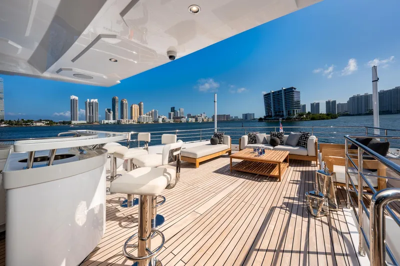 Slide: The Image of Luxurious deck of 2020 Majesty 100 yacht with city skyline view. - 16