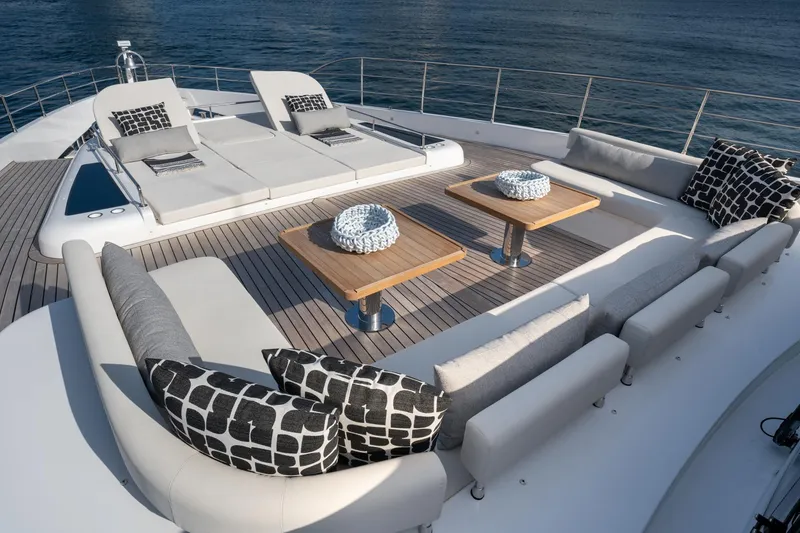 Slide: The Image of Luxurious deck seating area on a 2020 Majesty 100 yacht with ocean view. - 18
