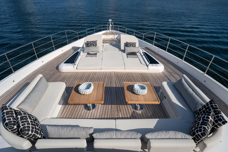 Slide: The Image of Luxurious deck of 2020 Majesty 100 yacht with sun loungers and seating area. - 19