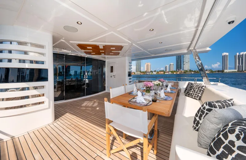 Slide: The Image of Luxury outdoor dining area on 2020 Majesty 100 yacht with ocean view. - 20