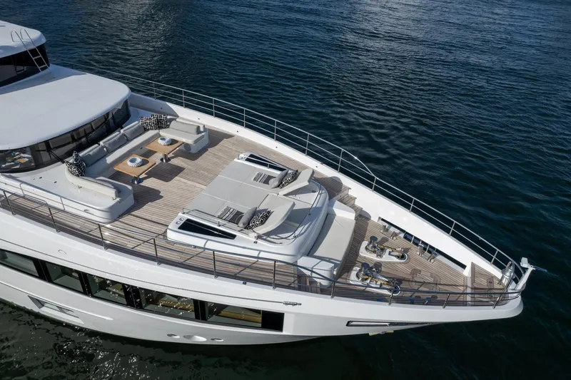 Slide: The Image of 2020 Majesty 100 yacht with spacious deck and luxurious seating. - 23