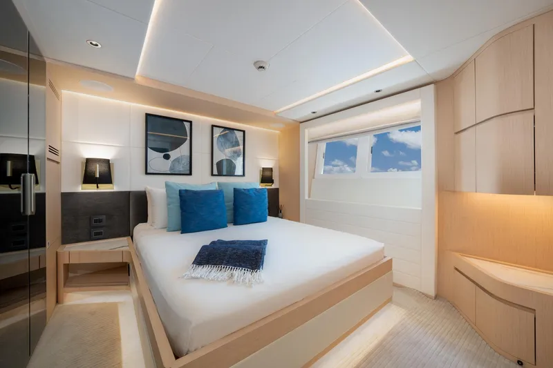 Slide: The Image of Luxurious bedroom interior of 2020 Majesty 100 yacht with modern decor and ocean view. - 7