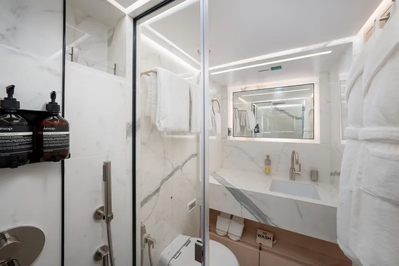 Slide: The Image of Luxurious bathroom in 2020 Majesty 100 yacht with marble finishes and modern amenities. - 8