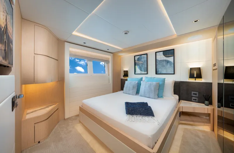 Slide: The Image of Luxurious bedroom interior of 2020 Majesty 100 yacht with modern decor and ocean view. - 9