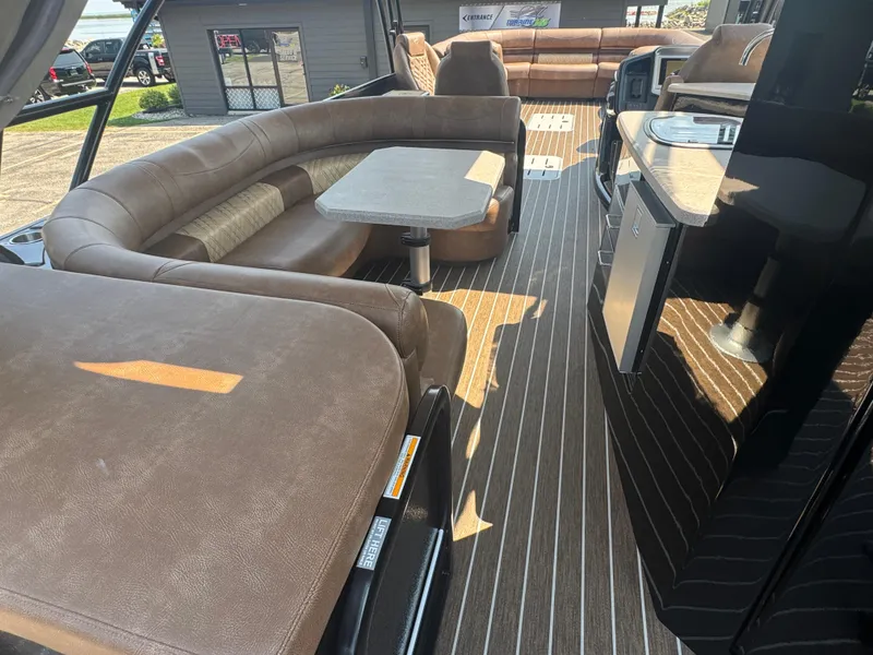 Slide: The Image of Luxurious interior of 2026 Premier Escalante pontoon boat with plush seating and modern amenities. - 12