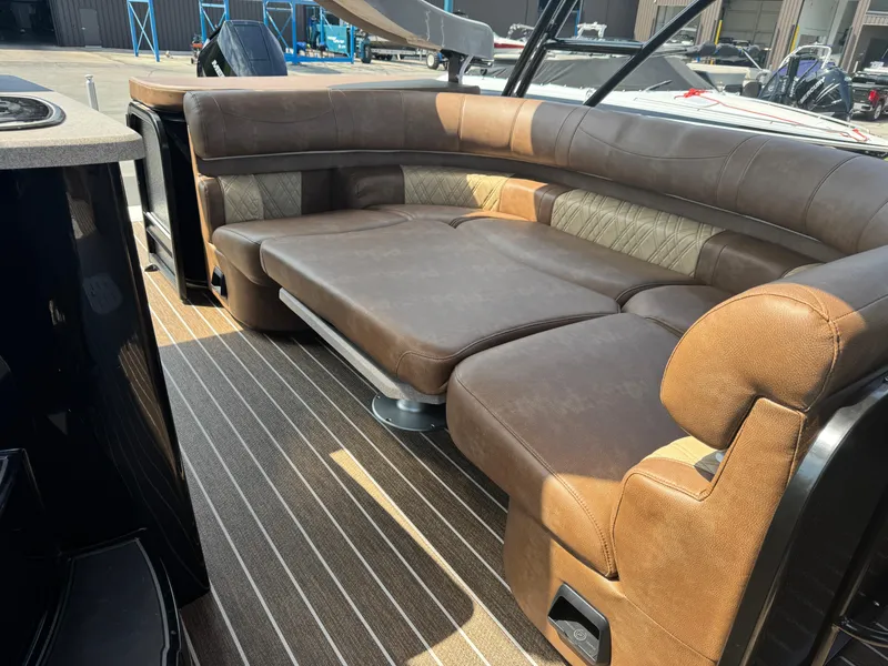 Slide: The Image of Luxurious seating on 2026 Premier Escalante boat with brown leather upholstery. - 16