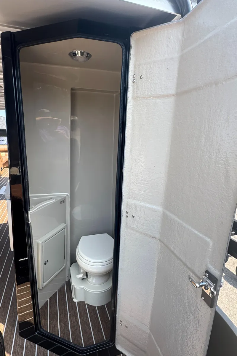 Slide: The Image of 2026 Premier Escalante boat bathroom with modern design and compact toilet. - 25