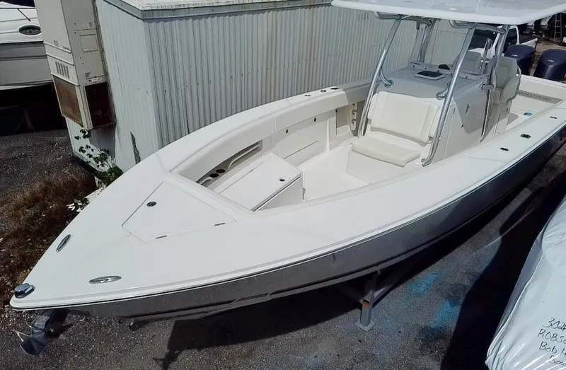 Slide: The Image of 2013 Jupiter 34 Center Console boat in storage yard. - 7
