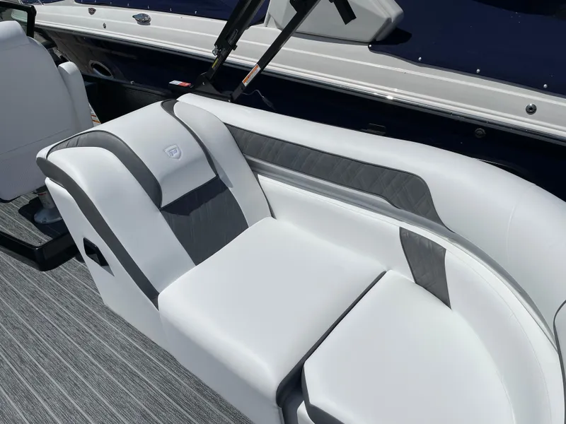 Slide: The Image of 2024 Premier Supersport boat interior with sleek white and gray seating. - 12