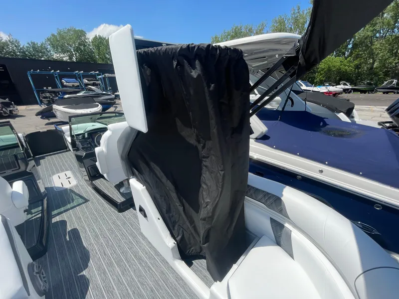 Slide: The Image of 2024 Premier Supersport boat interior with seating and canopy, showcasing modern design and comfort. - 13