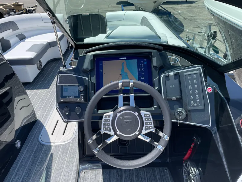 Slide: The Image of 2024 Premier Supersport boat dashboard with modern steering and navigation system. - 15