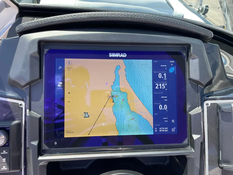 Slide: The Image of Simrad navigation display on 2024 Premier Supersport boat dashboard. - 17