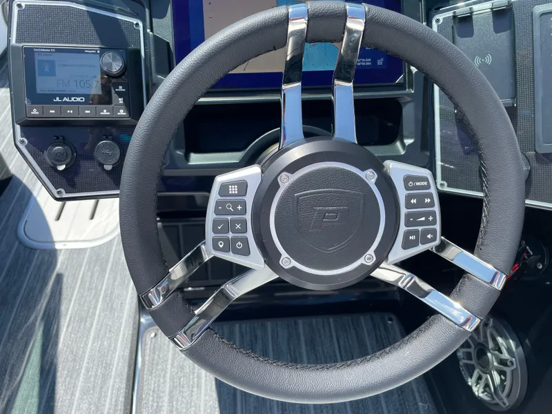 Slide: The Image of Steering wheel of 2024 Premier Supersport with control buttons and sleek design. - 19