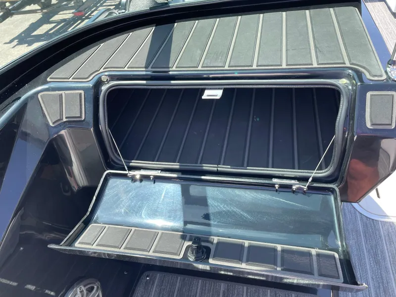 Slide: The Image of Open storage compartment in a 2024 Premier Supersport boat. - 20