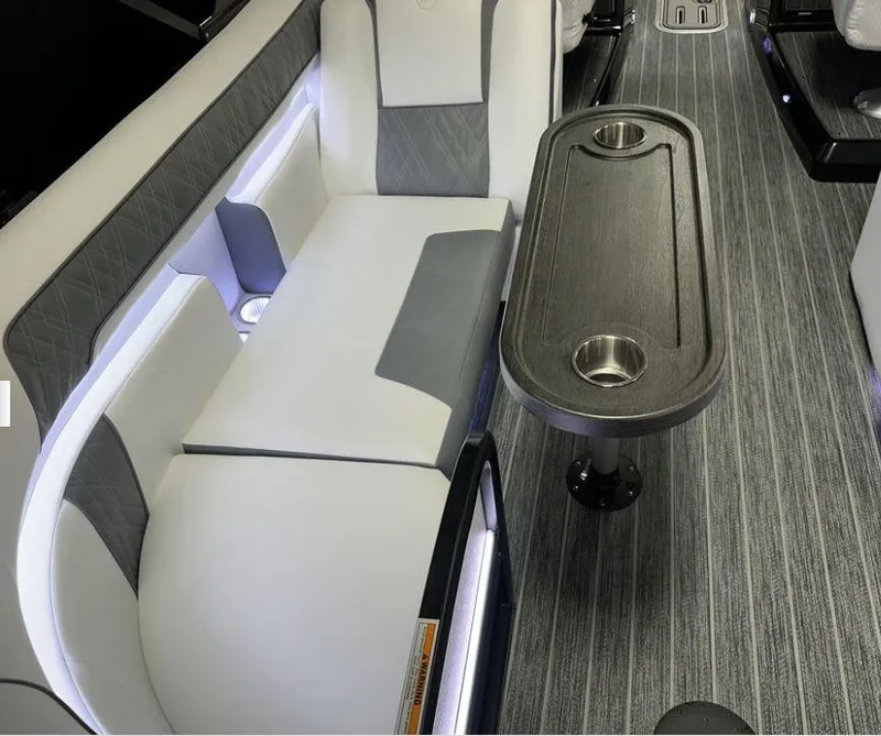 Slide: The Image of 2024 Premier Supersport interior with sleek seating and modern table design. - 29