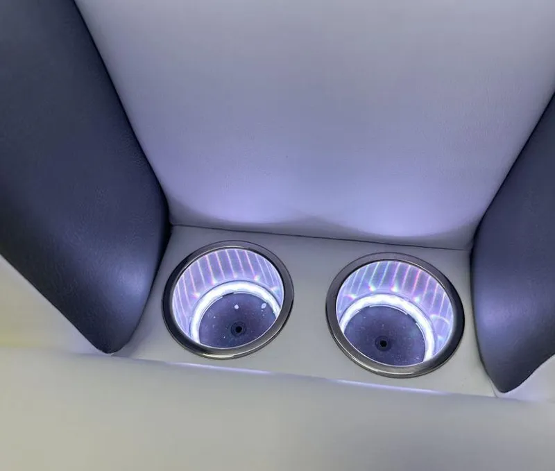 Slide: The Image of 2024 Premier Supersport illuminated cup holders in a sleek interior design. - 32