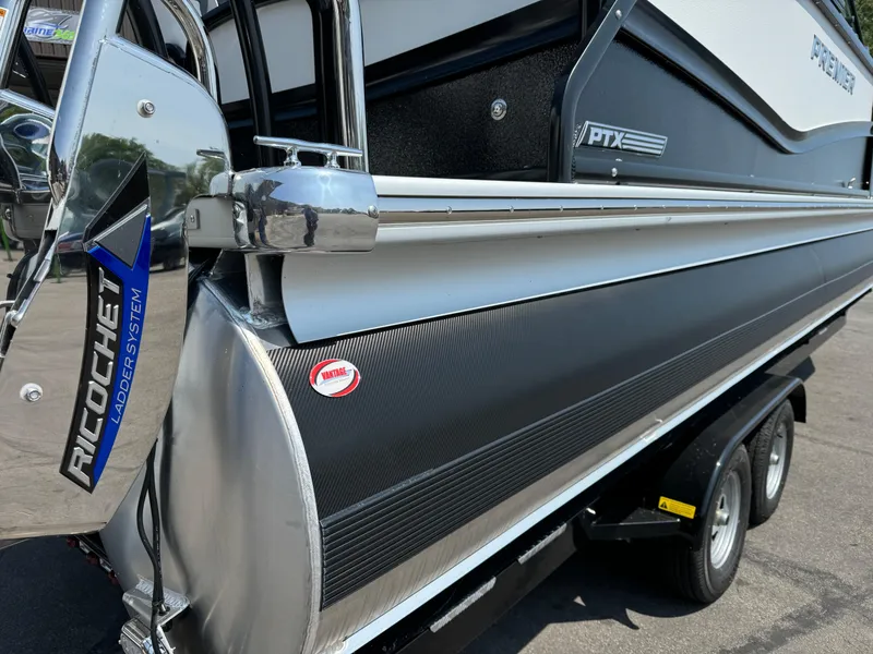 Slide: The Image of 2024 Premier Supersport boat with Ricochet ladder system on trailer. - 8