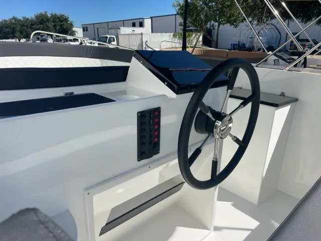 Slide: The Image of 2023 Maxima 620 Retro boat steering console with modern controls and sleek design. - 4