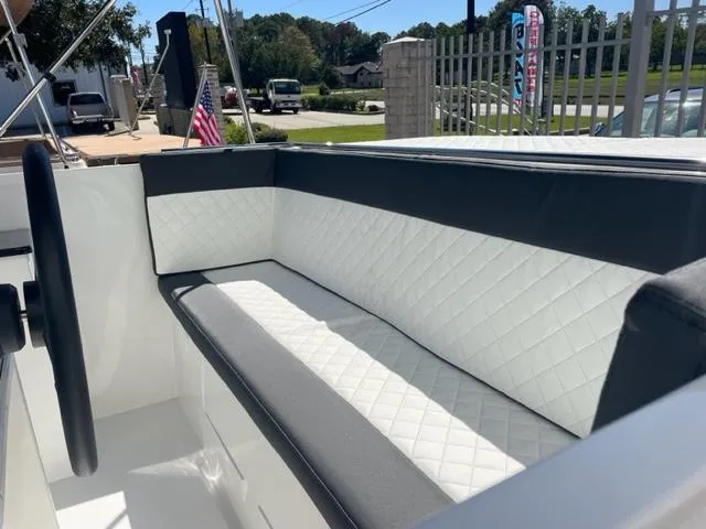 Slide: The Image of 2023 Maxima 620 Retro boat interior with white and black quilted seating. - 5