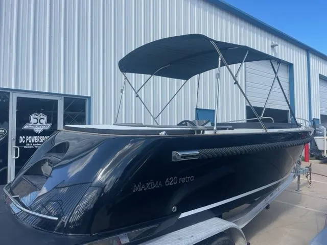 Slide: The Image of 2023 Maxima 620 Retro boat with canopy at DC Powersports. - 9