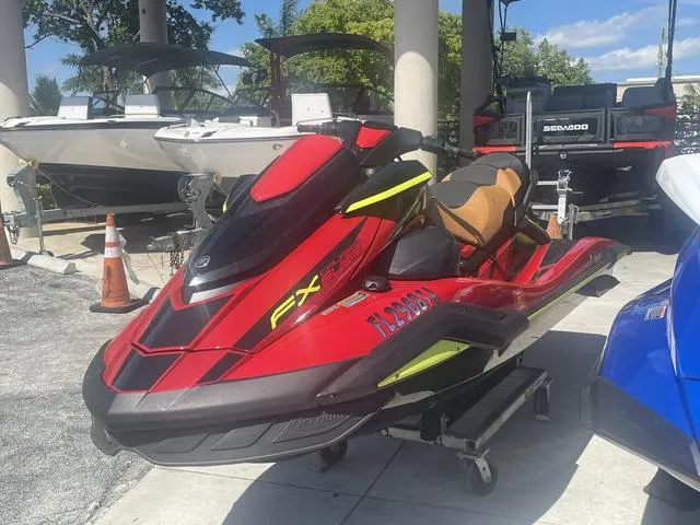 Slide: The Image of 2022 Yamaha WaveRunner FX Cruiser SVHO with Audio System, red and black, displayed outdoors. - 3